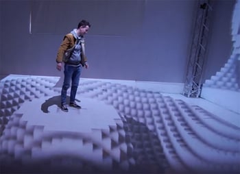 Man standing in 3D projection mapping space