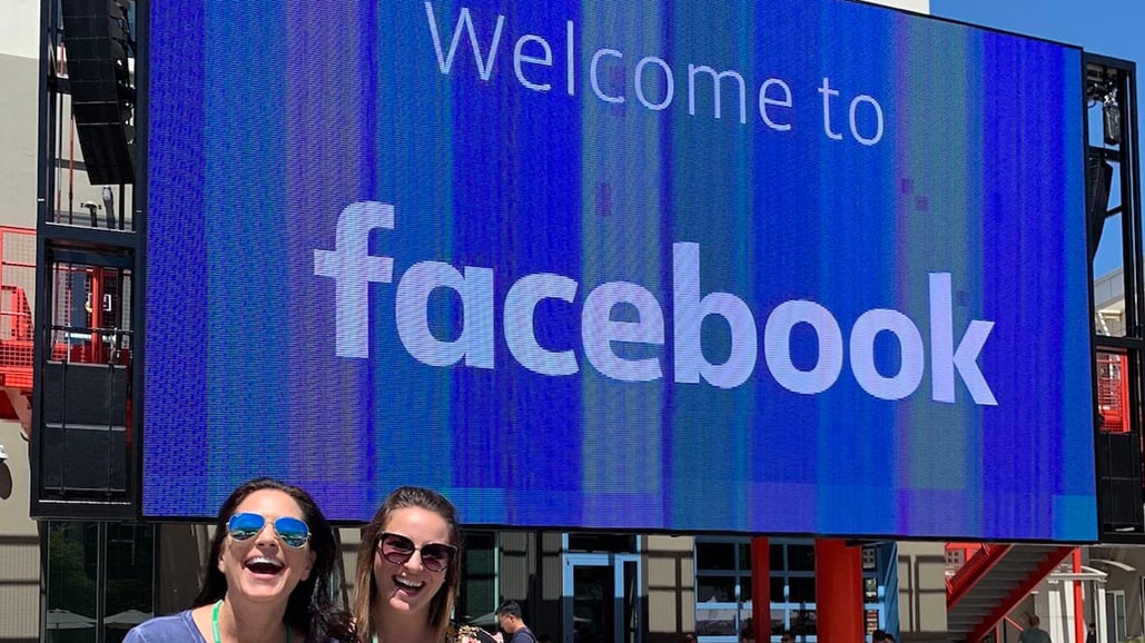 VMG Studios CEO and founder Kelly Sparks and VP of Key Accounts Alysia Lee stand outside Facebook headquarters next to "Welcome to Facebook" sign