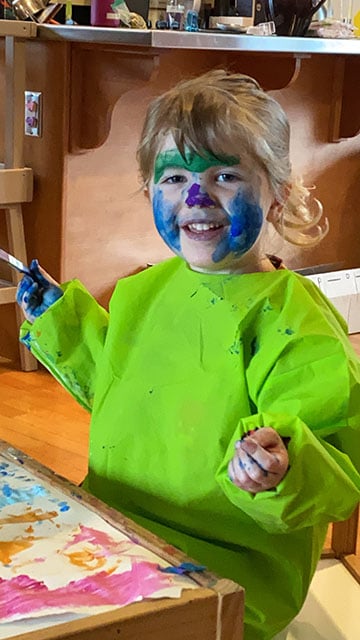 VMG Studios producer's daughter with paint on her face while virtual learning during COVID-19