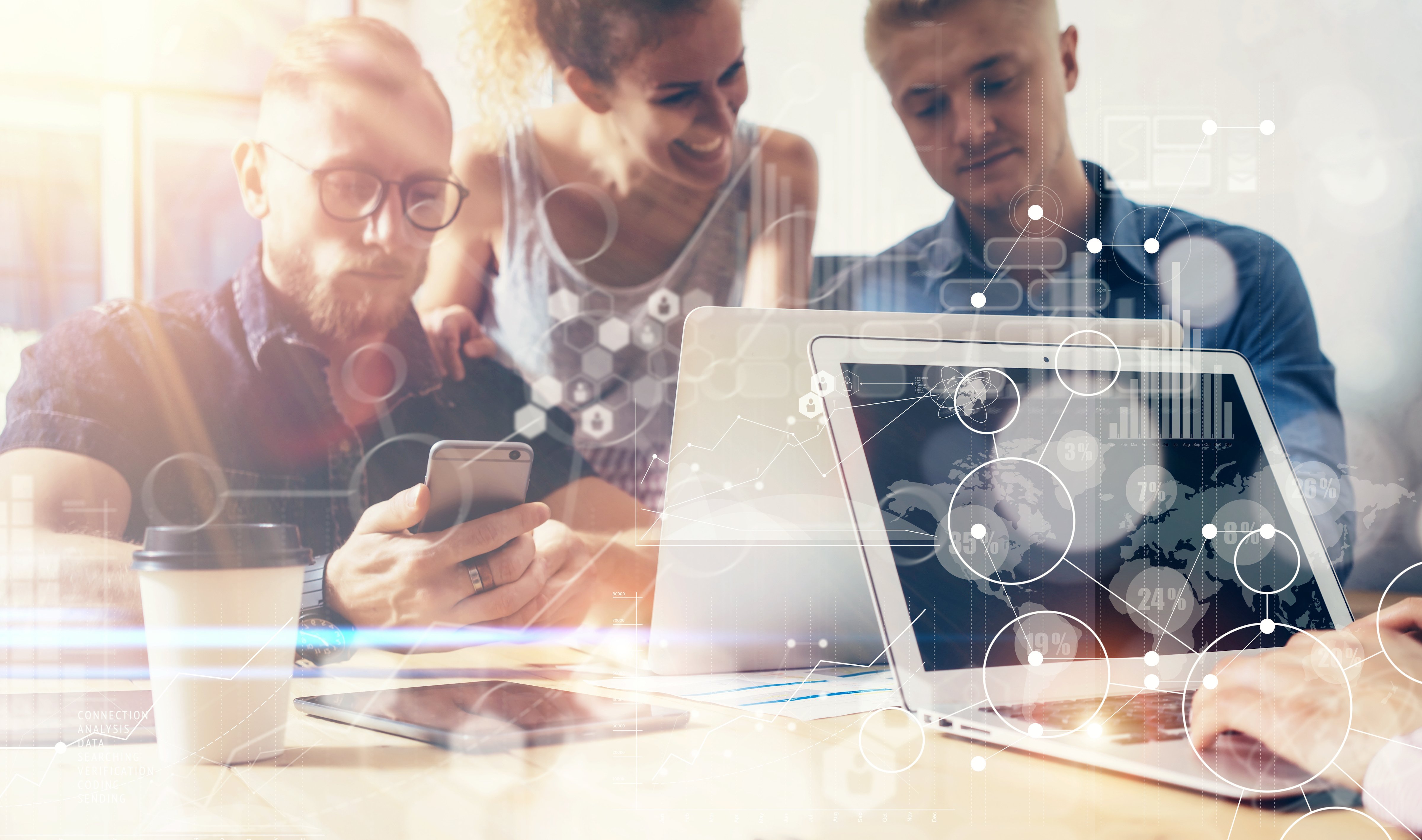 3 people looking at computer and smartphone with an interactive media element overlay 