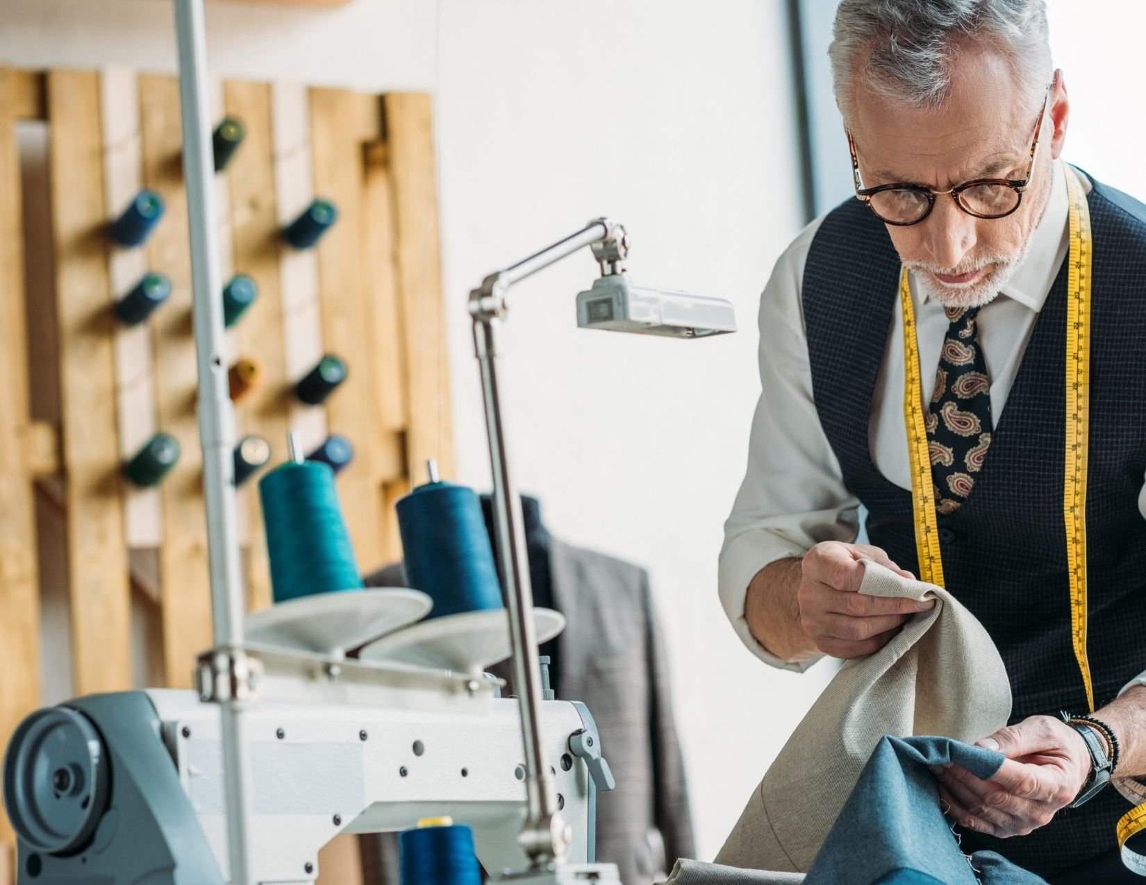 Tailor looking at fabric