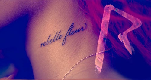 Rihanna's French tattoo which reads "rebelle fleur"