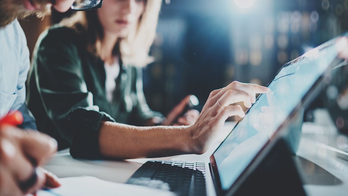 Woman working on a screen in an office space