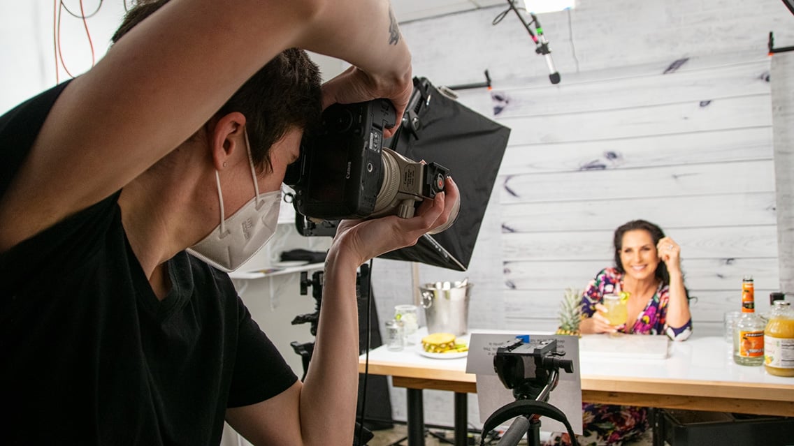 Professional photographer taking pictures in studio setting