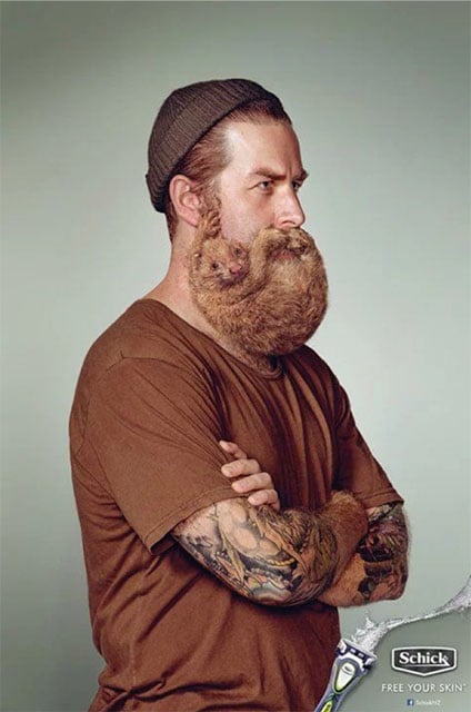 Man wearing a beanie with a beard that appears to be a sloth-type animal