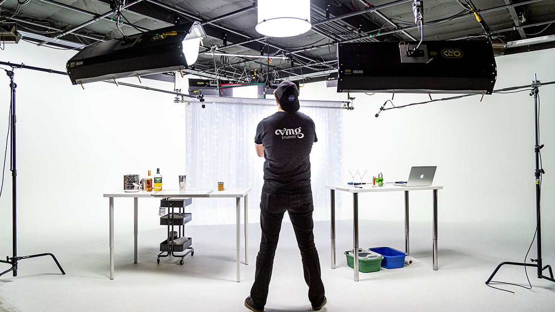 VMG Studios Director of Photography, Hunter, looking at a setup for a video production shoot in studio